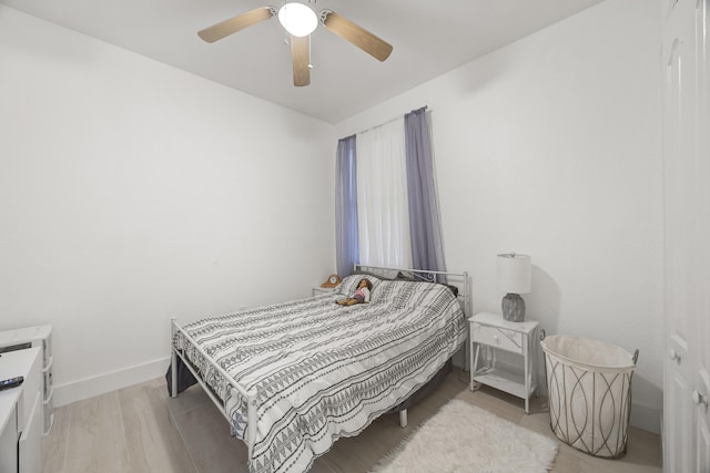 bedroom featuring ceiling fan and light hardwood / wood-style flooring