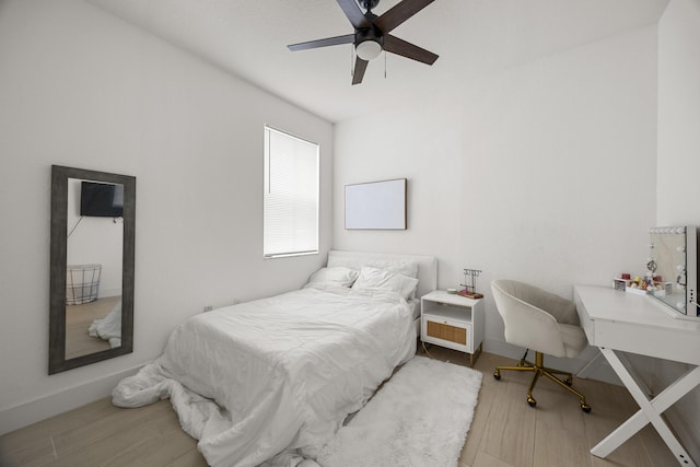 bedroom featuring wood-type flooring and ceiling fan