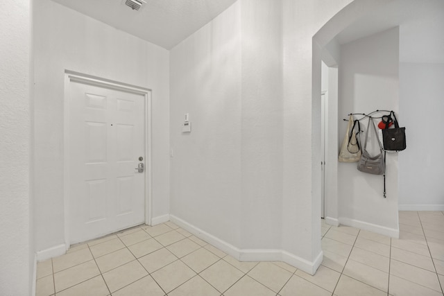 interior space featuring light tile patterned flooring