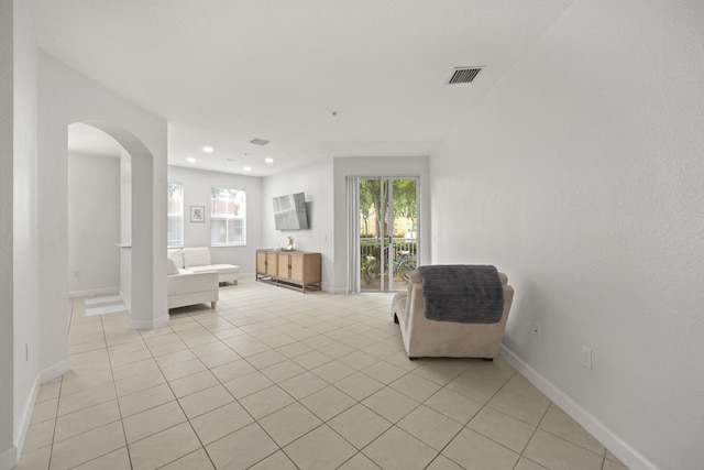 unfurnished room featuring light tile patterned flooring