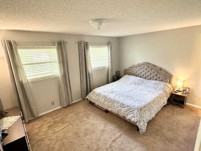 carpeted bedroom with a textured ceiling