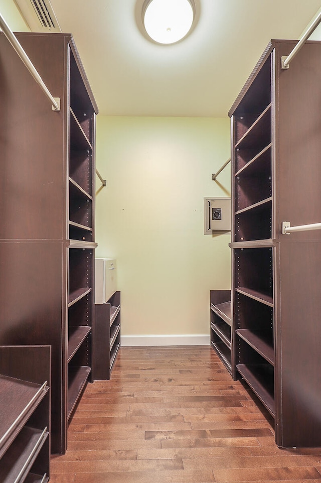 walk in closet featuring hardwood / wood-style flooring