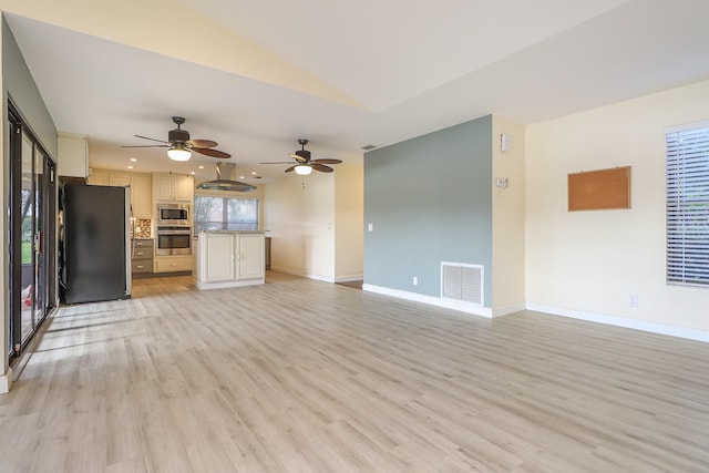 unfurnished living room featuring light wood-type flooring and ceiling fan