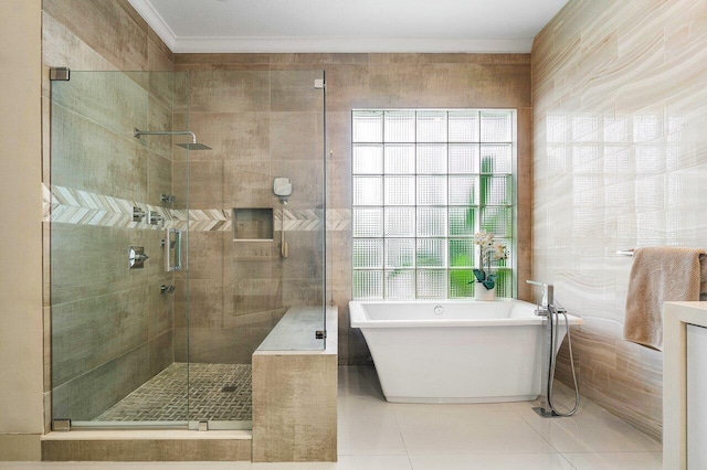 bathroom featuring ornamental molding, tile patterned flooring, plenty of natural light, and separate shower and tub