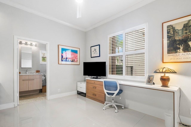 office space featuring ornamental molding, light tile patterned flooring, sink, and built in desk