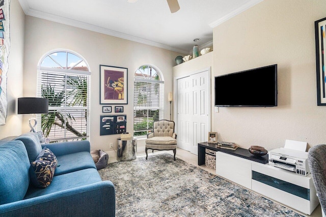 living room with crown molding, a healthy amount of sunlight, and ceiling fan