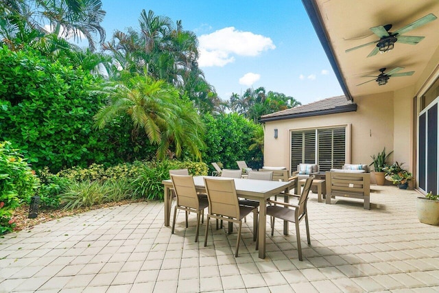 view of patio with ceiling fan and an outdoor living space