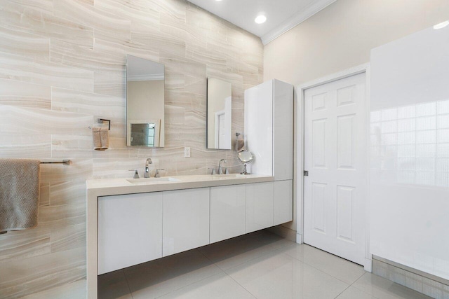 bathroom featuring vanity, crown molding, tile patterned floors, and tile walls