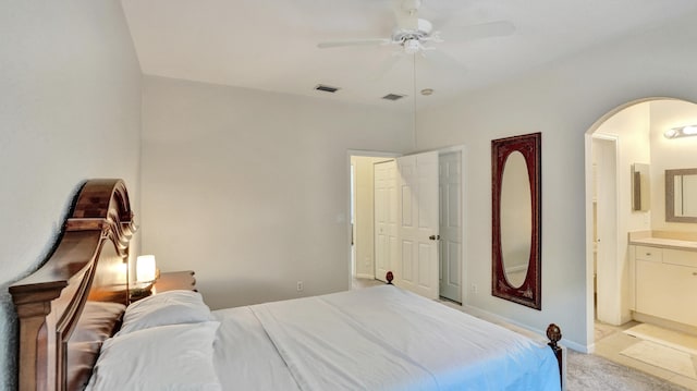 bedroom with ceiling fan and ensuite bathroom