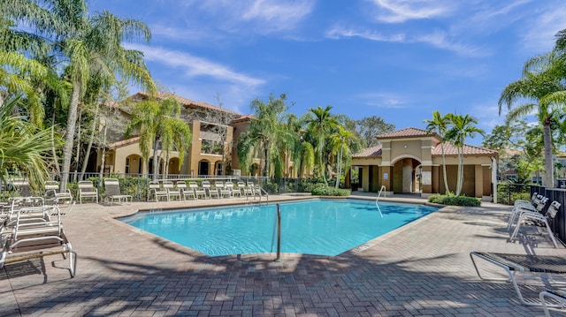 view of swimming pool featuring a patio area