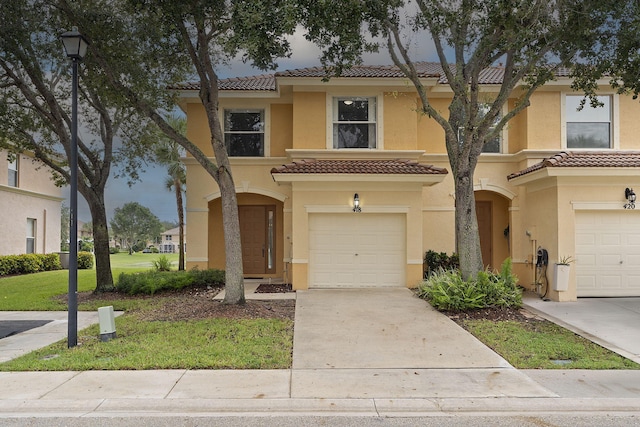 view of front facade featuring a garage and a front yard