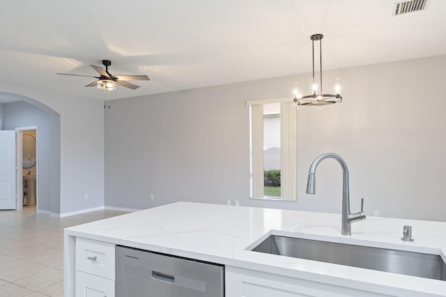 kitchen featuring dishwasher, light stone counters, sink, white cabinets, and hanging light fixtures