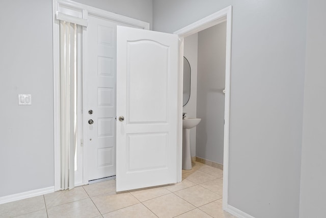 hallway featuring light tile patterned floors