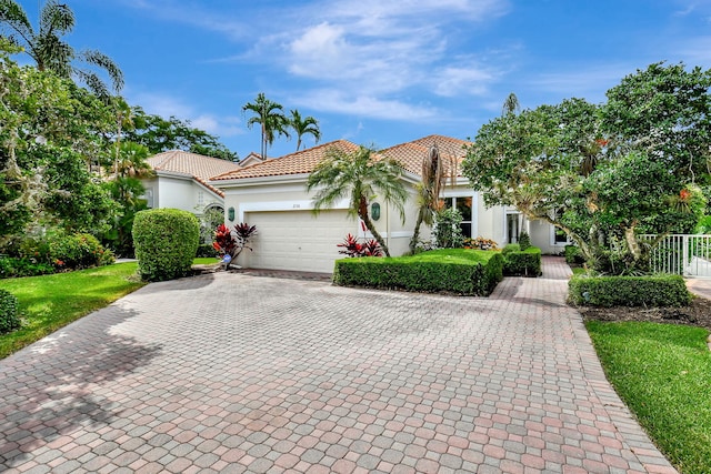 mediterranean / spanish-style house featuring a garage