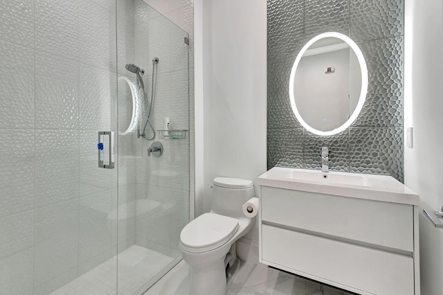 bathroom with vanity, toilet, and an enclosed shower