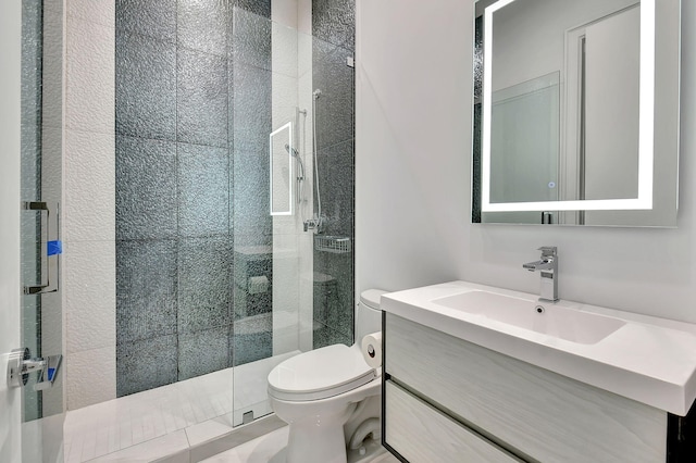 bathroom with vanity, toilet, and an enclosed shower