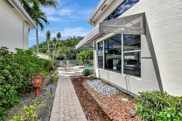 view of yard featuring a patio area and a fenced in pool