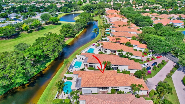 bird's eye view with a water view