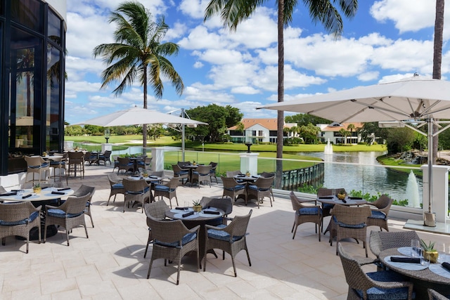 view of patio with a water view