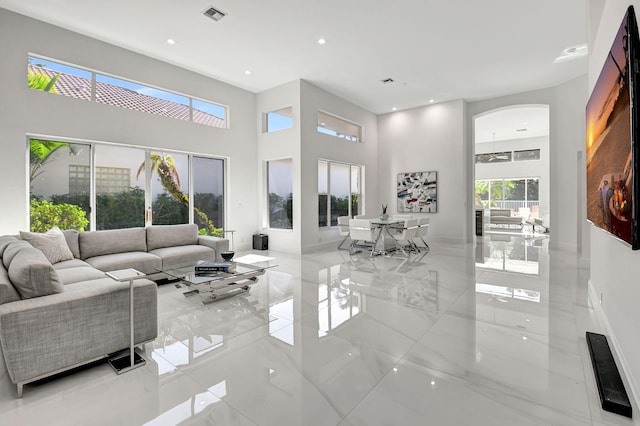 living room featuring a high ceiling