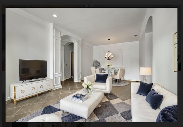 tiled living room with crown molding and a chandelier