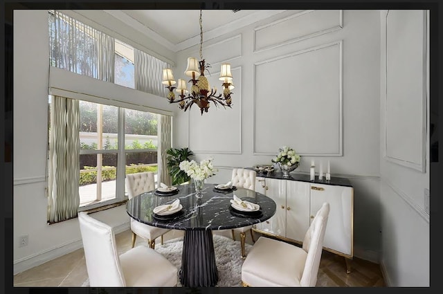 tiled dining room featuring ornamental molding and a notable chandelier