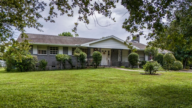 ranch-style home with a front yard and a porch