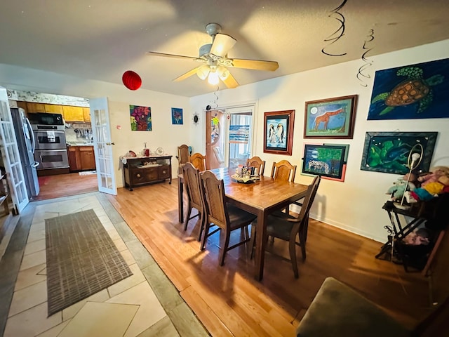 dining area featuring ceiling fan and light hardwood / wood-style flooring