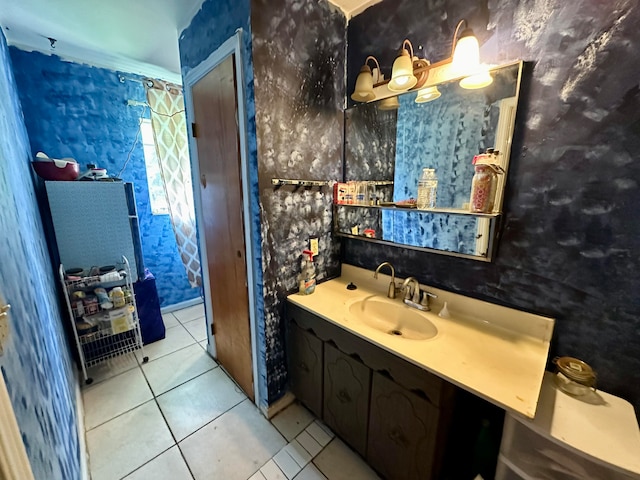 bathroom featuring tile patterned flooring, vanity, and ornamental molding