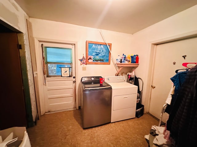 washroom featuring light colored carpet and washer and clothes dryer