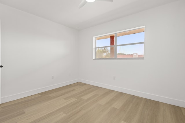 empty room featuring light hardwood / wood-style flooring and ceiling fan