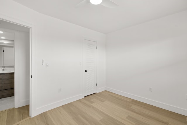 unfurnished room with ceiling fan and light hardwood / wood-style flooring