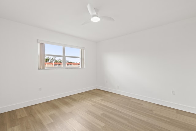 spare room featuring light wood-type flooring and ceiling fan