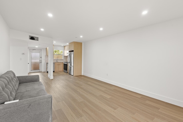 unfurnished living room featuring light hardwood / wood-style floors