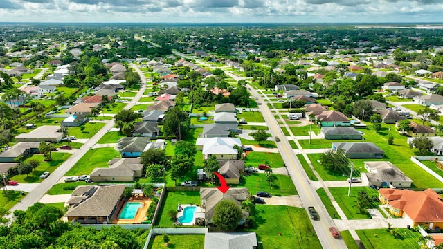 birds eye view of property with a residential view