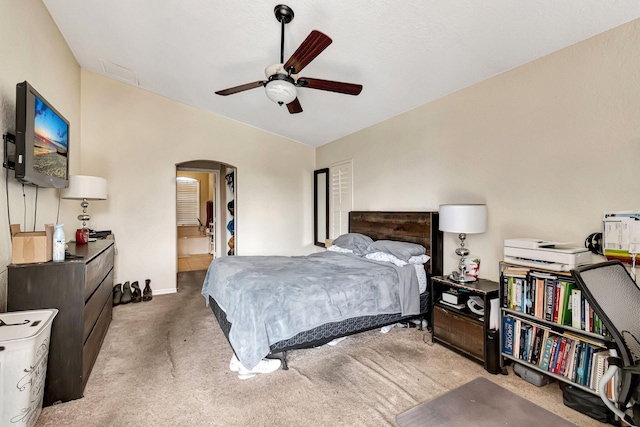 bedroom featuring carpet flooring, ceiling fan, and ensuite bathroom