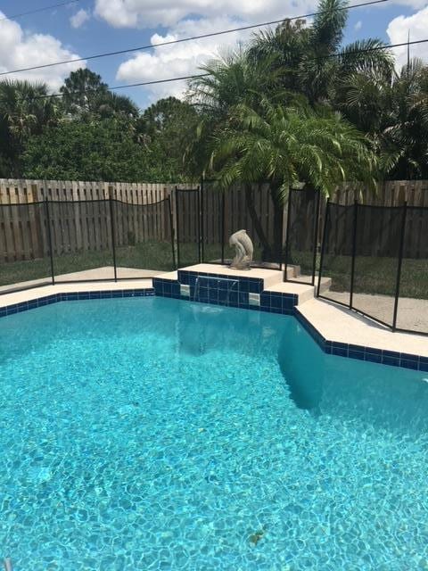 view of pool with a fenced in pool and a fenced backyard