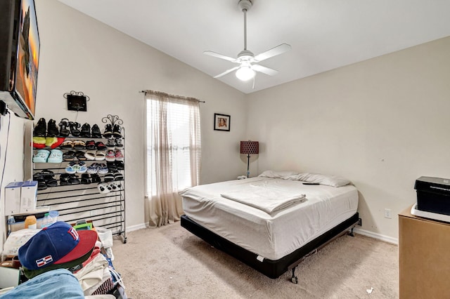 carpeted bedroom featuring ceiling fan and lofted ceiling