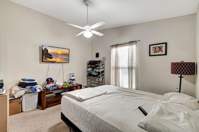 bedroom with ceiling fan and light colored carpet