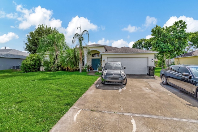 view of front of home featuring a front lawn, central air condition unit, and a garage