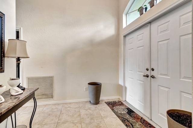 view of tiled foyer entrance