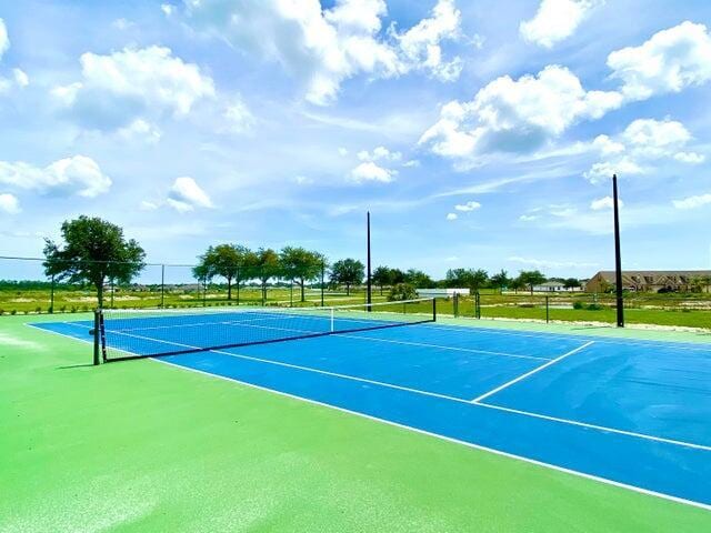 view of sport court with fence