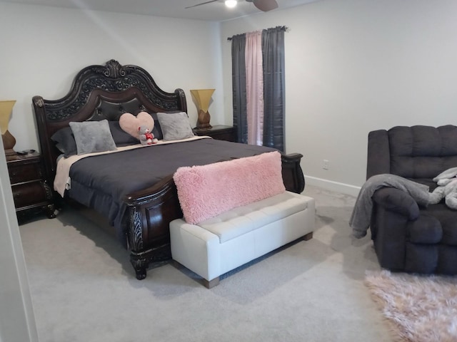 carpeted bedroom featuring ceiling fan and baseboards