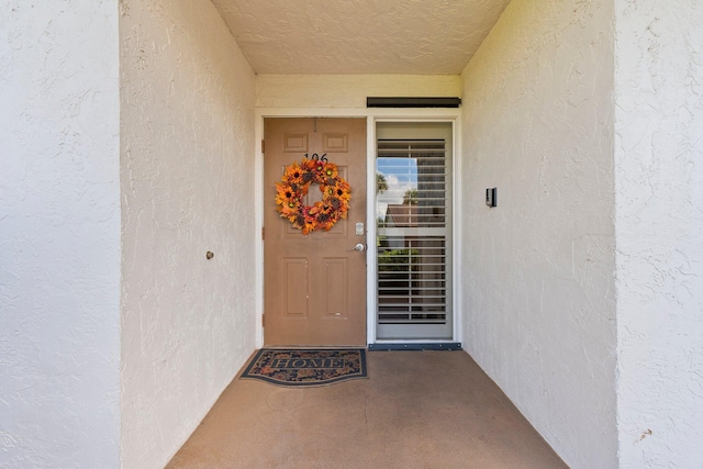 3500 Twin Lakes Ter Unit 106, Fort Pierce, FL 34951 - doorway to property with stucco siding