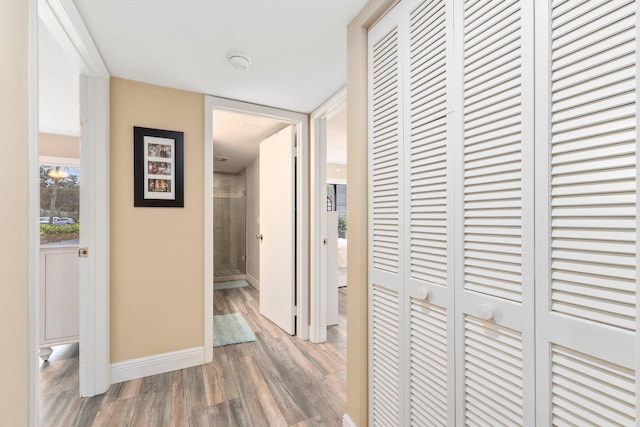 3500 Twin Lakes Ter Unit 106, Fort Pierce, FL 34951 - hallway with baseboards and wood finished floors