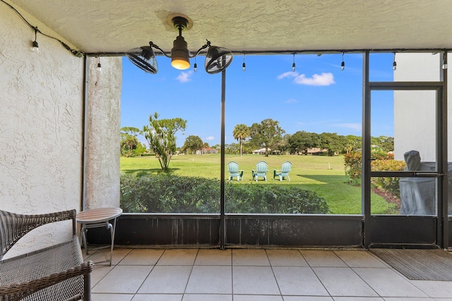 3500 Twin Lakes Ter Unit 106, Fort Pierce, FL 34951 - unfurnished sunroom featuring a wealth of natural light and a notable chandelier