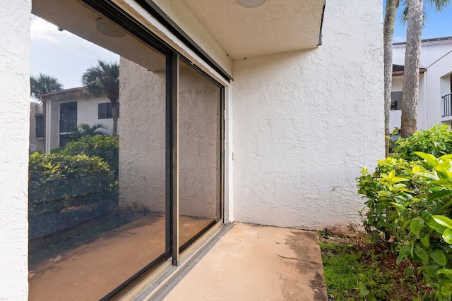 entrance to property with a balcony