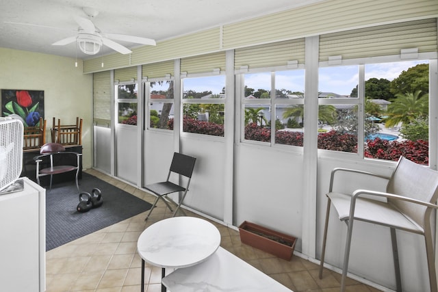 sunroom / solarium with ceiling fan