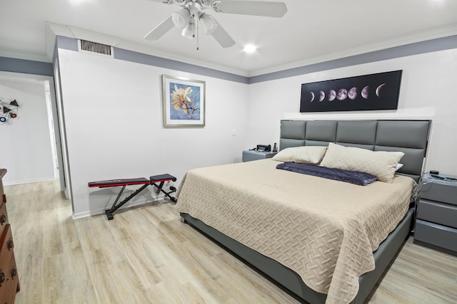 bedroom with light hardwood / wood-style flooring, ornamental molding, and ceiling fan