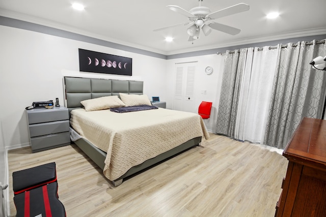 bedroom with ornamental molding, light hardwood / wood-style floors, and ceiling fan